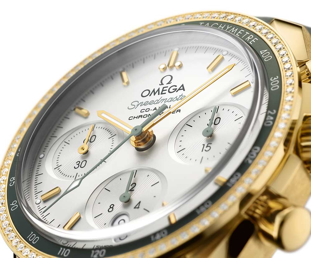 omega speedmaster 38 mm closeup yellow gold