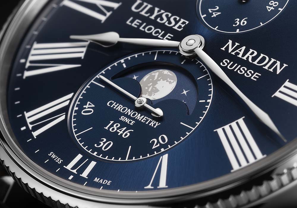 ulysse nardin marine torpilleur moonphase blue dial closeup